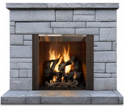 Majestic Castlewood built-in outdoor wood fireplace with burning logs