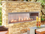 Superior VRE4600 outdoor gas fireplace installed in a stone patio wall