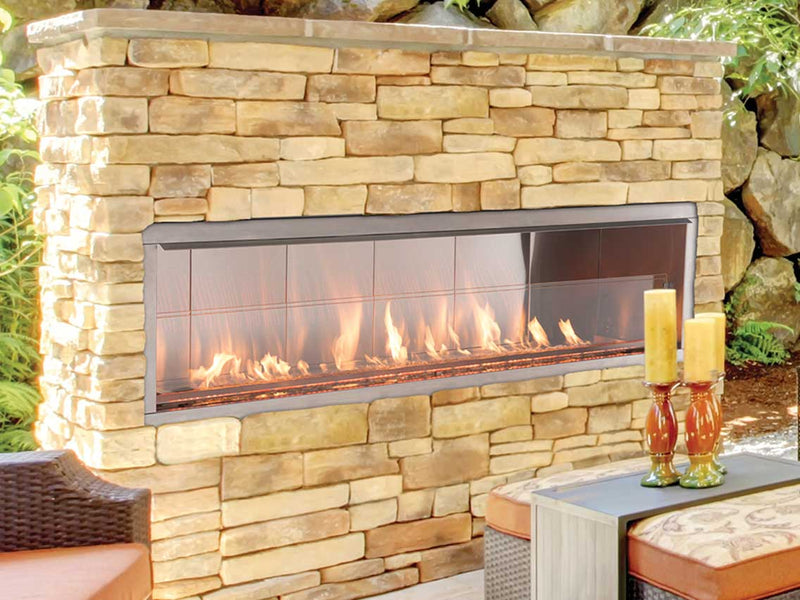 Superior VRE4600 outdoor gas fireplace installed in a stone patio wall