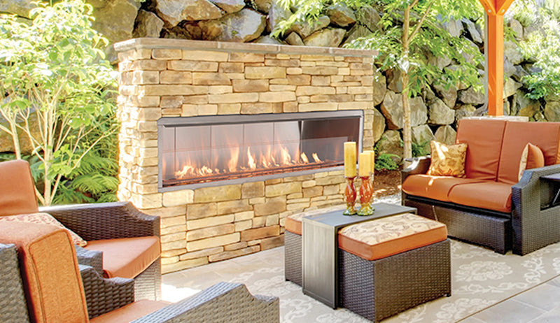 Superior VRE4600 outdoor gas fireplace in a stone outdoor living area